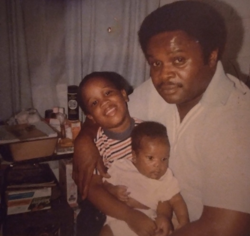 A young Dr. Marcus Rushing with his father — a cherished early memory