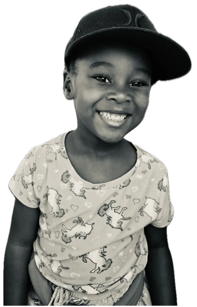 A young girl in a Dad-Beats shirt smiling brightly — the next generation