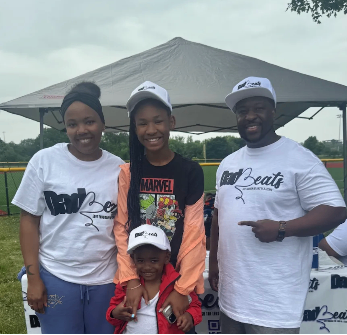 Family at the Dad-Beats competition — mother, daughter and father all in Dad-Beats gear